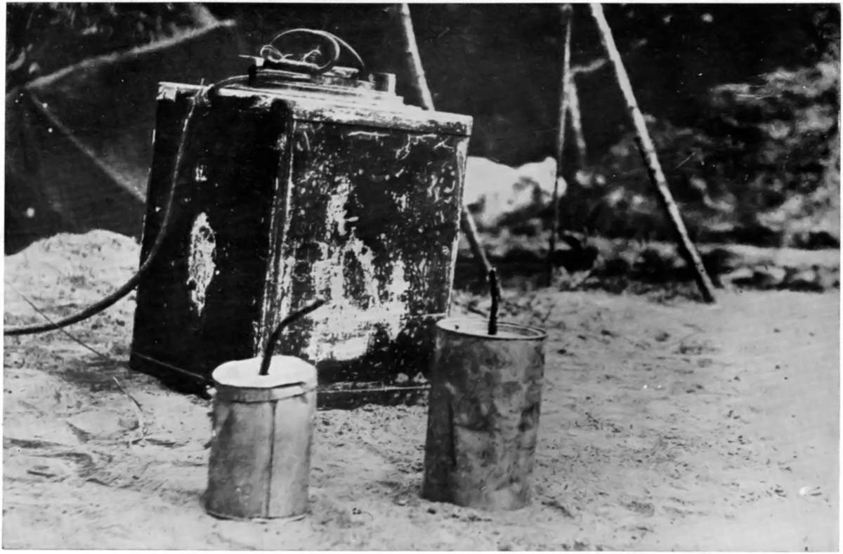 WEAPONS OF GREY "MOLES," AT TSING-TAU: A LAND-MINE AND EMERGENCY HAND-GRENADES CAPTURED FROM THE GERMANS.