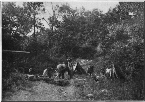 Making Camp on an Overnight Hike. Tents and other equipment come by trek cart.