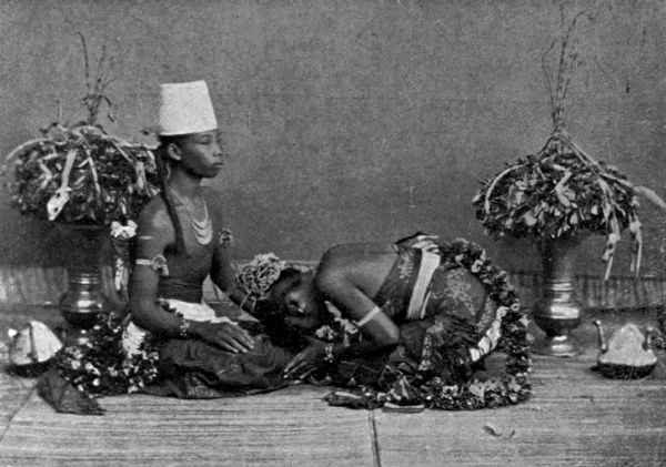 Humbly kneeling down, the bride proceeded to wash the bridegroom's feet, in token of loving submission.