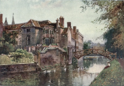 QUEENS’ COLLEGE FROM THE RIVER FRONT  On the left is seen the garden front of the President’s Lodge. The wooden bridge designed by Etheridge (1749) is known as the Mathematical Bridge. In the distance are the two old mills—the King’s Mill and the Bishop’s Mill.