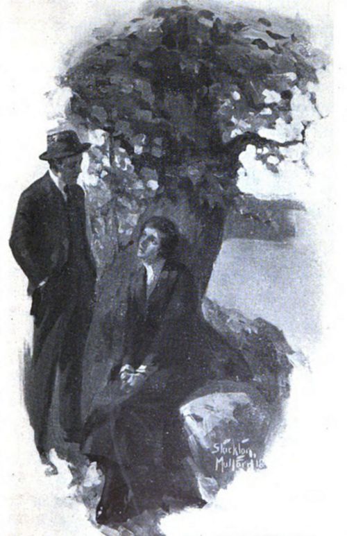 A woman sits beneath a tree by the water, gazing up at a man standing nearby; both appear deep in conversation, shaded by leafy branches.