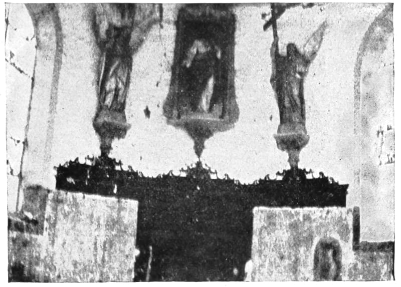 Damaged statues in a building.
