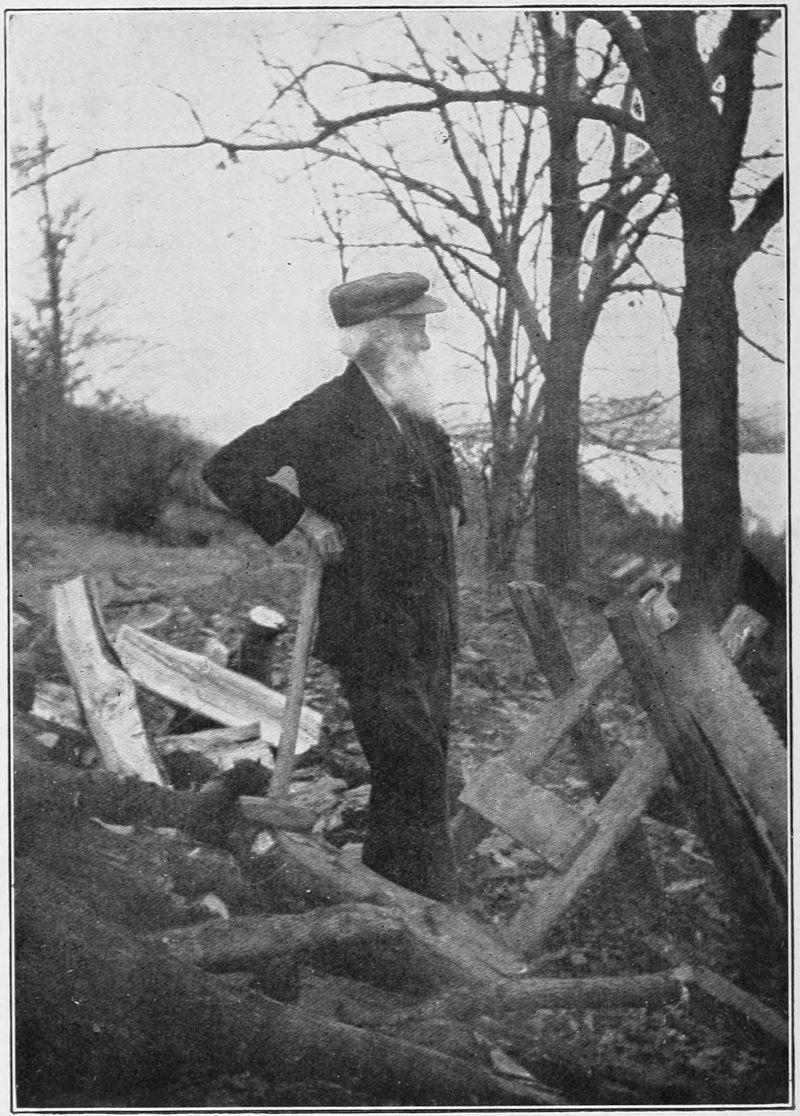 Old photograph of the author chopping wood.