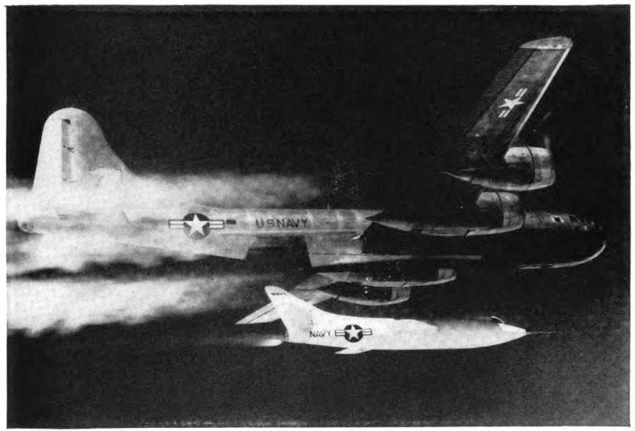 A smaller airplane directly underneath a larger airplane