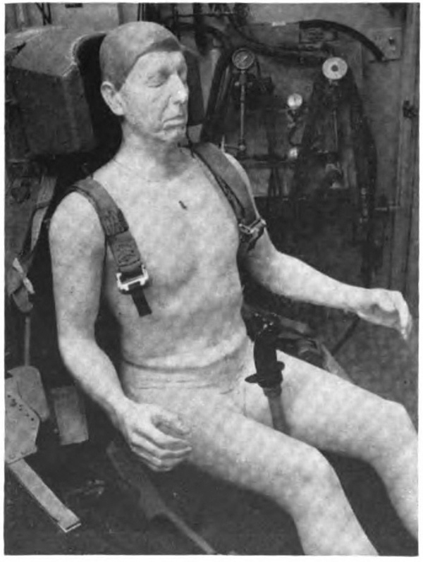 Statue of a seated man with straps on his shoulders