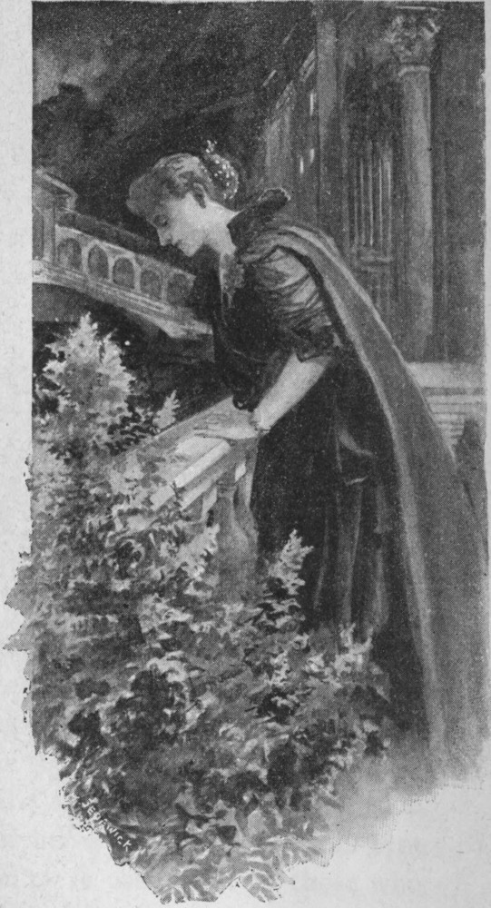 A woman looking over the edge of a balcony