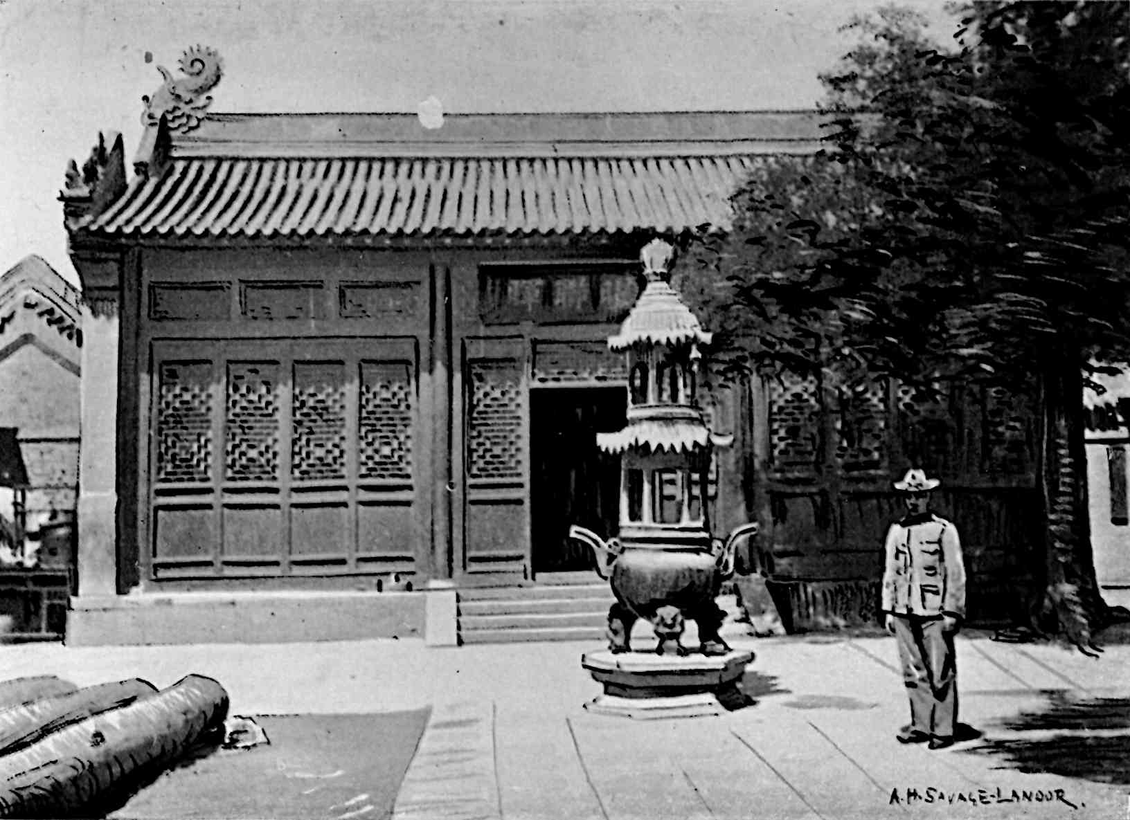 Building in back, with a small tower in middle, with a man in uniform on right