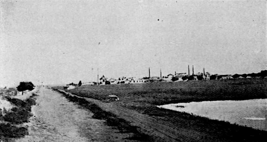 Road with buildings in background