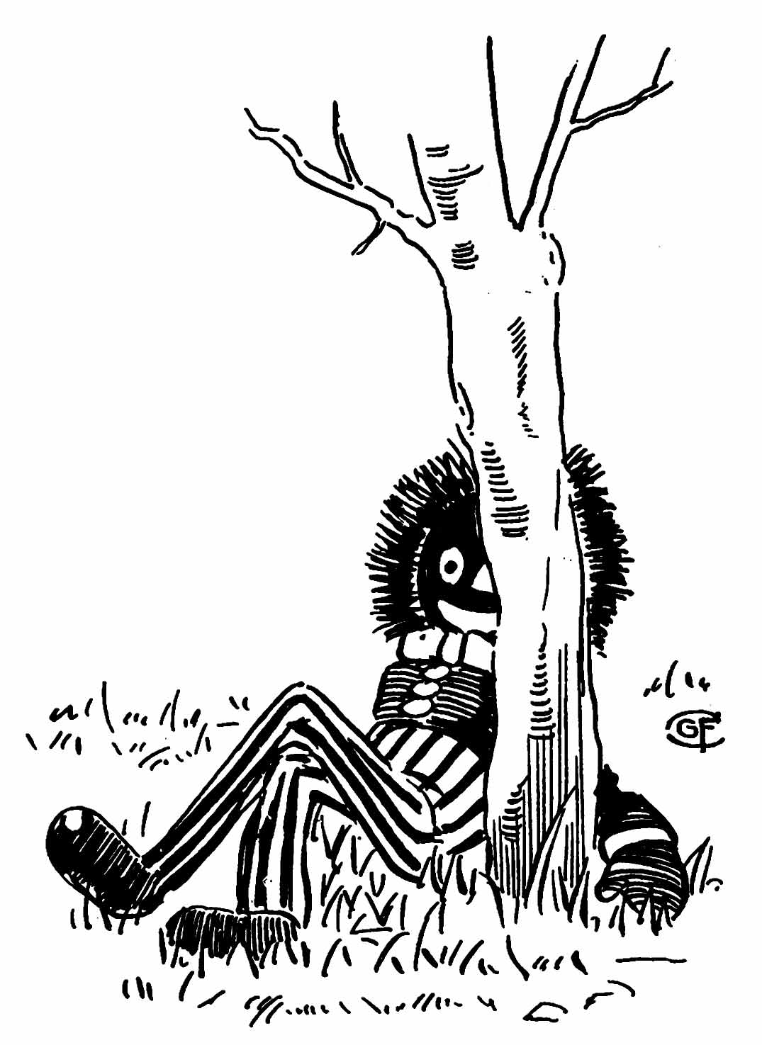 Golliwogg with legs crossed sits on the ground behind a tree